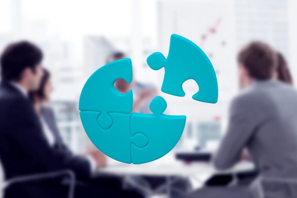 Jigsaw circle against positive business group having a meeting
