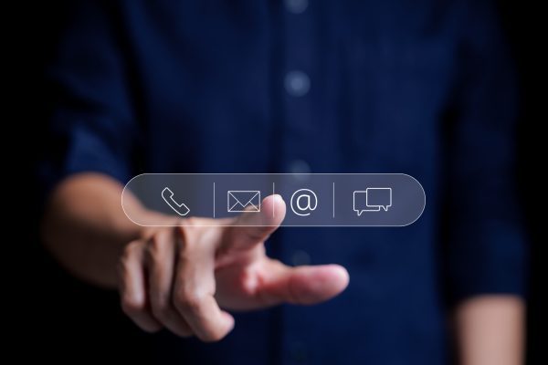 Contact us or Customer support hotline people connect. Man touching on virtual screen contact icons email, telephone, address, live chat, Service concept and customer support Business Contact.
