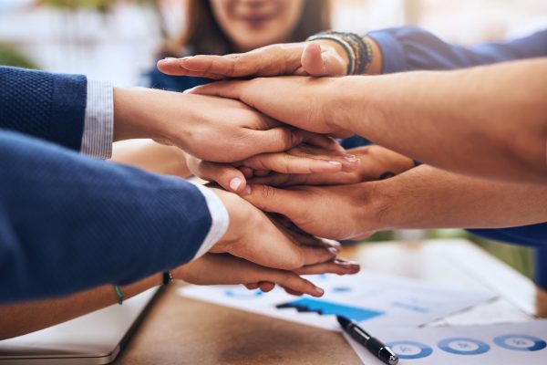 Trust, hands together and team building in collaboration for office meeting, huddle or partnership. Business people, onboarding and pride for promotion, company or networking as accounting consultant.